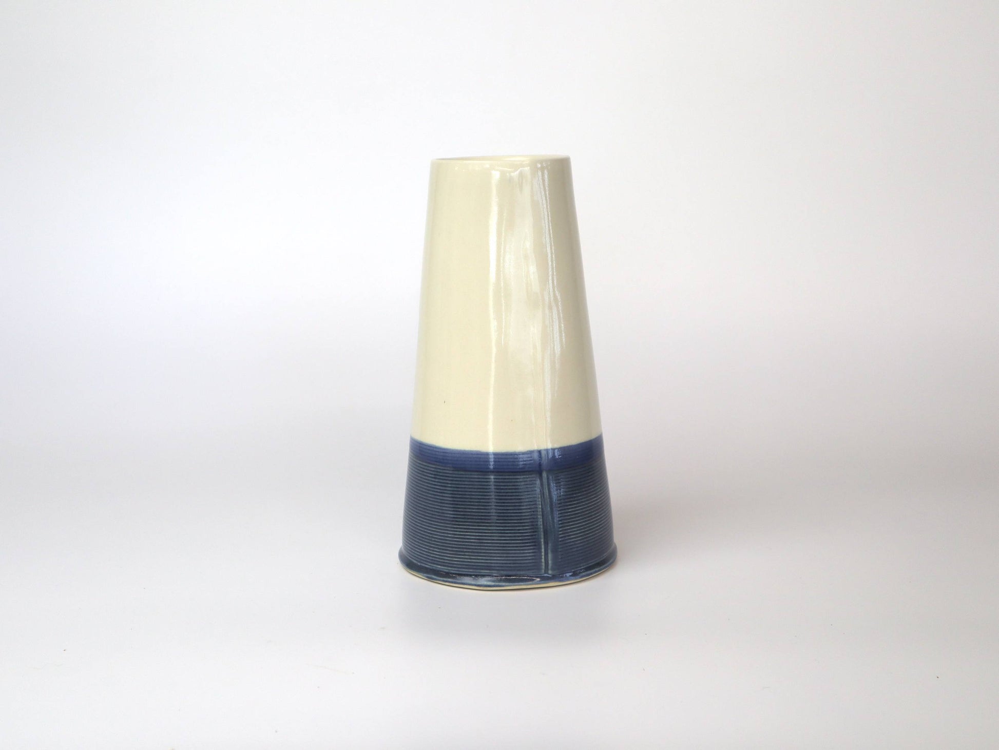 Handcrafted porcelain vase in soothing blue tone, adorned with Ginkgo Biloba leaves, perfect for adding natural charm to decor.