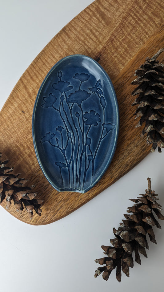 Blue Spoon Rest featuring an artistic design of Poppy Flowers and Bees on high-quality porcelain.