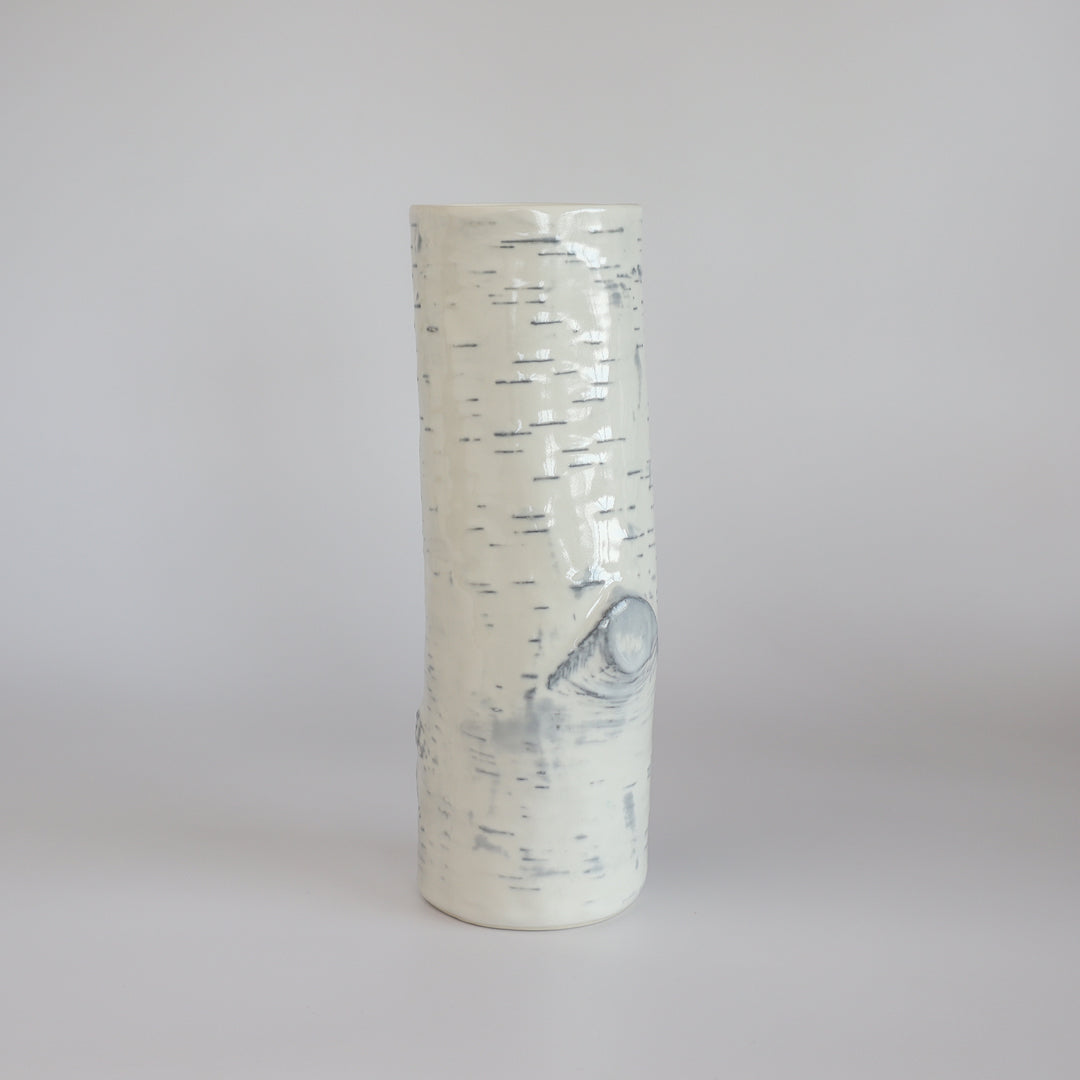 Empty handcrafted birch ceramic vase highlighting its elegant design and texture.