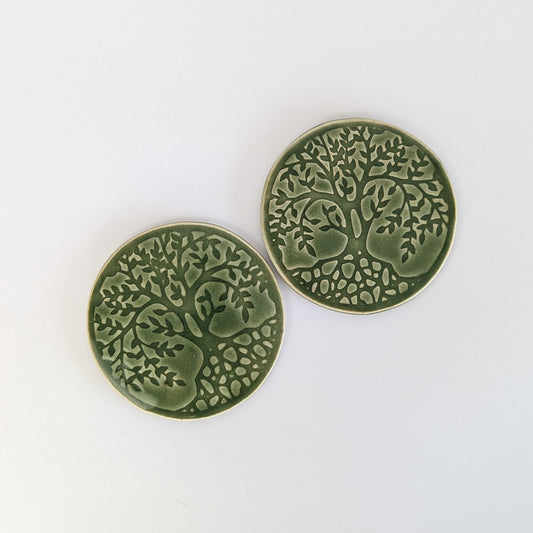 Handcrafted ceramic coasters featuring a vibrant Tree of Life design.