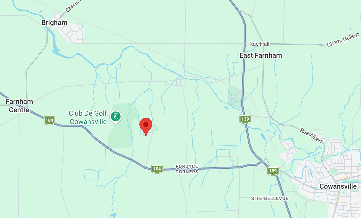 Map with a red marker indicating a location near Cowansville, Quebec.